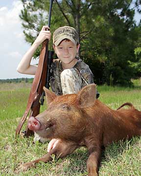 Jared with his first hog