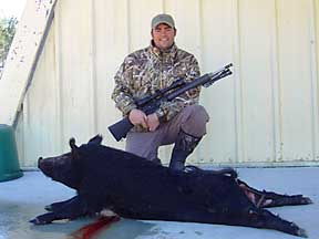 Hank with his 150lb Boggy Creek boar