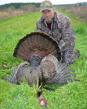Jim and his great gobbler swinging a 10.5 inch beard