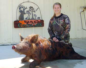 Kendall with her 160 pound Boggy Creek hog