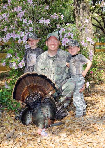 Jeff with his boys Bo and Will Hunt and his big gobbler