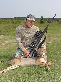 Guy with his boggy Creek coyote