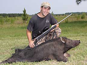 Andrew with his first hog
