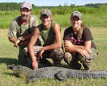 Gary and Kendall with Colby and his gator