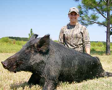 Kendall and her Boggy Creek boar