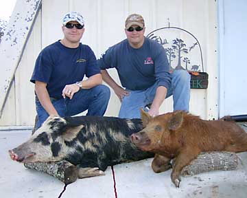 Lane and Brent with his two hogs