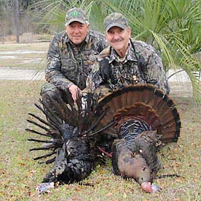 Danny and master turkey hunter Larry Proffitt with his two big gobblers from last season