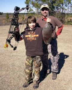 Tom with his son Cameron with his bow-kill armadillo
