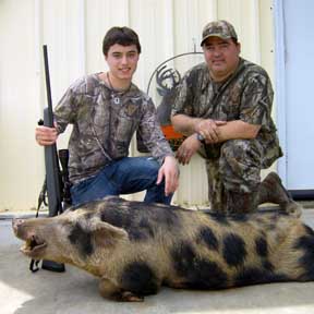 16-year-old Jessie with his dad Oscar and his first boar
