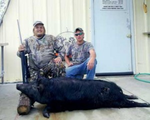Smiley and guide Quentin with his big lowcountry sow