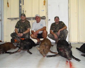 Danny with the Treestand Assassins and their 4 hogs