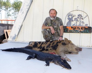 Gary with his 6ft 3in gator and 160lb boar hog