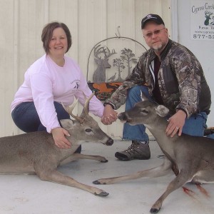 Lorey with her first buck and husband Mark with his doe